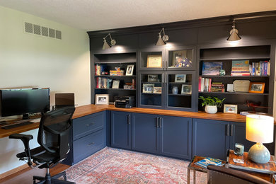Mid-sized elegant built-in desk home office photo in Other