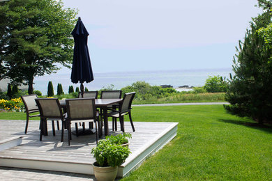 Design ideas for a large traditional backyard patio in Portland Maine.