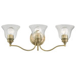 Livex Lighting - Moreland 3 Light Antique Brass Vanity Sconce - Bring a refined lighting style to your bath area with this Moreland collection three light vanity sconce. Shown in an antique brass finish and clear glass.