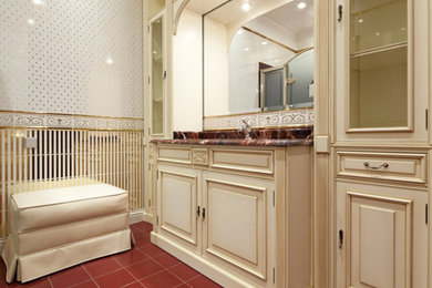 Design ideas for a mid-sized traditional master bathroom in New Orleans with beaded inset cabinets, beige cabinets, multi-coloured walls, ceramic floors, an undermount sink, granite benchtops and red floor.