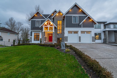 Example of a large farmhouse exterior home design in Vancouver