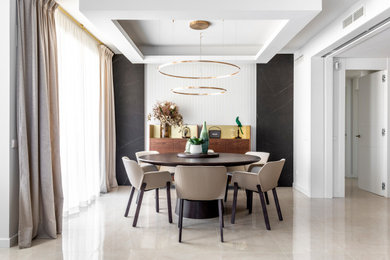 Example of a transitional dining room design in Madrid