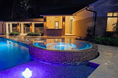 Example of a mid-sized trendy pool design in Houston