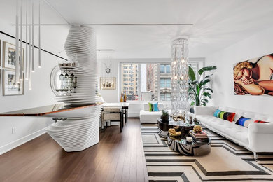 Large trendy open concept dark wood floor and brown floor living room photo in New York with white walls