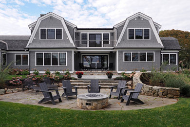 Large coastal gray exterior home idea in Boston with a gambrel roof and a shingle roof