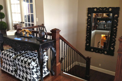 Example of a classic medium tone wood floor entryway design in Cincinnati with beige walls
