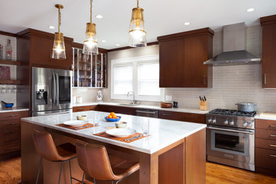 Inspiration for a mid-sized contemporary l-shaped medium tone wood floor and brown floor kitchen pantry remodel in Raleigh with a single-bowl sink, flat-panel cabinets, medium tone wood cabinets, quartzite countertops, beige backsplash, ceramic backsplash, stainless steel appliances, an island and white countertops