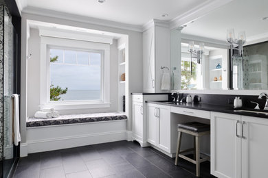Large beach style master porcelain tile, gray floor and double-sink alcove shower photo in Boston with shaker cabinets, white cabinets, gray walls, an undermount sink, quartz countertops, a hinged shower door, black countertops and a built-in vanity