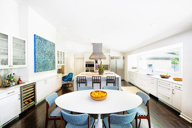 Eat-in kitchen - contemporary u-shaped eat-in kitchen idea in Dallas with flat-panel cabinets, white cabinets, an undermount sink, marble countertops, white backsplash, stone slab backsplash and stainless steel appliances