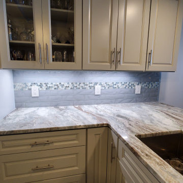 Backsplash with 3x12 textured glass and penny rounds