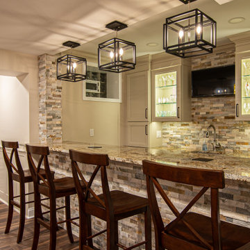 Basement Showing Warm Colors, Straight Lined Cabinets and Stacked Stone