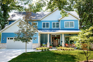 Mid-sized craftsman blue two-story mixed siding exterior home idea in St Louis with a mixed material roof