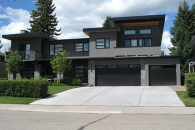 Home design - large contemporary home design idea in Calgary