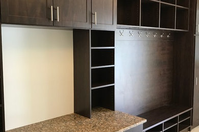 Mid-sized elegant porcelain tile and brown floor mudroom photo in Philadelphia with beige walls