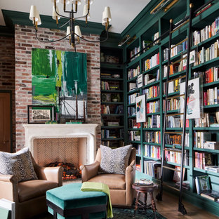 Exemple d'un grand bureau chic avec un mur vert, un sol en bois brun, une cheminée standard, un manteau de cheminée en pierre de parement, un bureau indépendant, un sol marron et un mur en parement de brique.