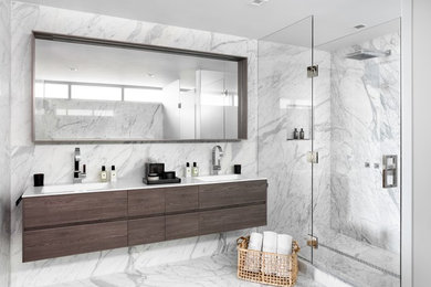 Inspiration for a large contemporary master gray tile, white tile and marble tile marble floor and gray floor bathroom remodel in Miami with gray walls, a hinged shower door, flat-panel cabinets, dark wood cabinets, an integrated sink and quartz countertops
