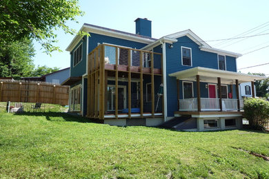 Inspiration for a contemporary blue exterior home remodel in Other