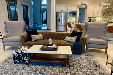 Large transitional open concept porcelain tile and beige floor living room photo in Dallas with beige walls, a standard fireplace, a tile fireplace and no tv