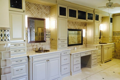 Inspiration for a large transitional master bathroom in Dallas with a drop-in sink, furniture-like cabinets, beige cabinets, granite benchtops, a drop-in tub, a double shower, a one-piece toilet, beige tile, ceramic tile, beige walls and marble floors.