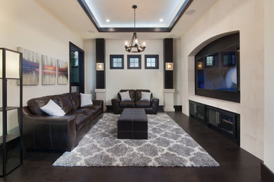 Mid-sized contemporary open concept home theatre in Orlando with white walls, dark hardwood floors and a wall-mounted tv.