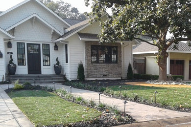 Photo of a mid-sized modern front yard driveway in Sacramento.