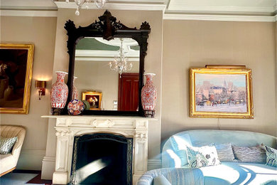 Example of a classic carpeted, wallpaper ceiling and wallpaper living room design in Boston with a stone fireplace