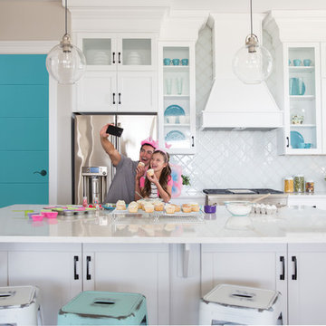 Contemporary Kitchen with White and Teal Accents and a Blue Door