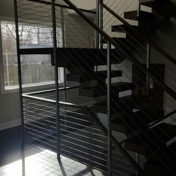 Open riser stairs with stainless steel cable wire railing
