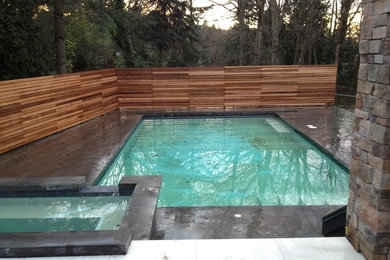 Hot tub - mid-sized contemporary backyard concrete and rectangular lap hot tub idea in Vancouver