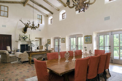Example of a huge eclectic formal and open concept brick floor living room design in Albuquerque with white walls, a standard fireplace, a stone fireplace and no tv