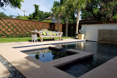 Large traditional backyard rectangular lap pool in Dallas with a hot tub and concrete pavers.