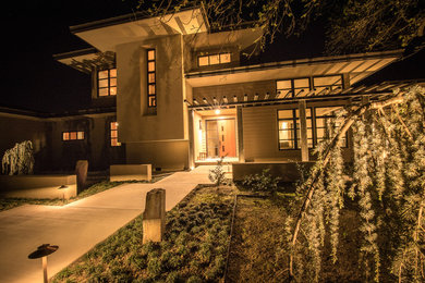 Inspiration for a modern beige two-story mixed siding exterior home remodel in Other