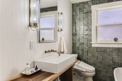 Small eclectic green tile and ceramic tile porcelain tile, multicolored floor and wallpaper powder room photo in Denver with medium tone wood cabinets, a bidet and a vessel sink