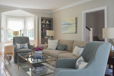Living room - transitional enclosed medium tone wood floor living room idea in New York with beige walls