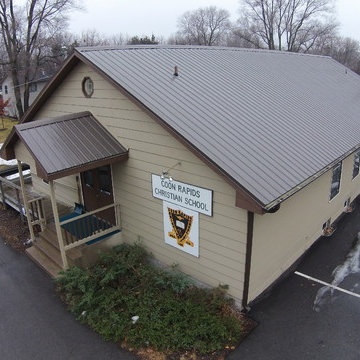 Metal roof and seamless gutters on a Church building
