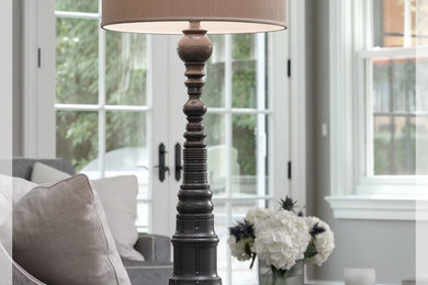 Family room - mid-sized traditional open concept light wood floor family room idea in Chicago with gray walls