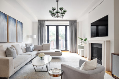 Inspiration for a scandinavian medium tone wood floor family room remodel in New York with white walls, a ribbon fireplace and a wall-mounted tv