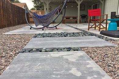 Inspiration for a contemporary backyard patio remodel in Phoenix with decking