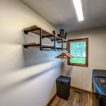 Laundry Room with Custom Cabinetry Quartz Countertop and Custom Floating Shelf