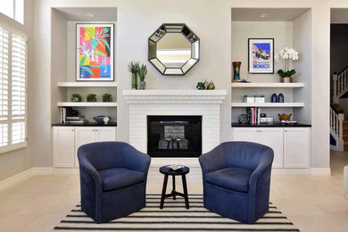 Family room - mid-sized transitional open concept porcelain tile and beige floor family room idea in Phoenix with beige walls, a standard fireplace, a brick fireplace and no tv