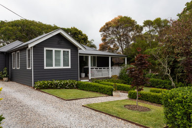 Photo of a mid-sized country one-storey blue house exterior in Wollongong.