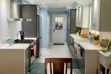 Example of a mid-sized minimalist galley ceramic tile and gray floor eat-in kitchen design in Los Angeles with a farmhouse sink, shaker cabinets, white cabinets, quartzite countertops, beige backsplash, ceramic backsplash, stainless steel appliances, no island and white countertops