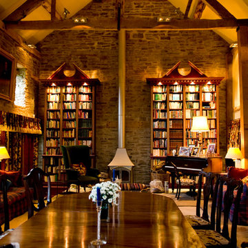 Gilded and painted library over several rooms in a converted 11th century barn