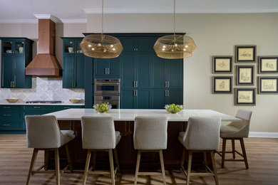 Example of a large beach style laminate floor kitchen design in Tampa with shaker cabinets, green cabinets, quartzite countertops, marble backsplash and white countertops