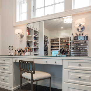 Walk-in closet - huge transitional gender-neutral carpeted and gray floor walk-in closet idea in Portland with beaded inset cabinets and blue cabinets