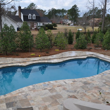 Fiberglass Swimming Pool with Travertine Decking and Automatic Cover