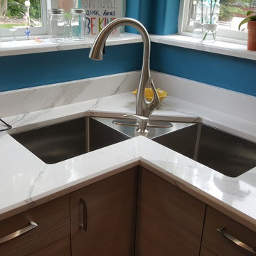 This is a two tone updated kitchen with efficient use of space & feature points