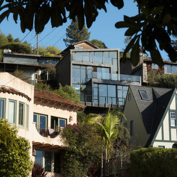 Bay-facing rear exterior nestled in the neighborhood - Fold House
