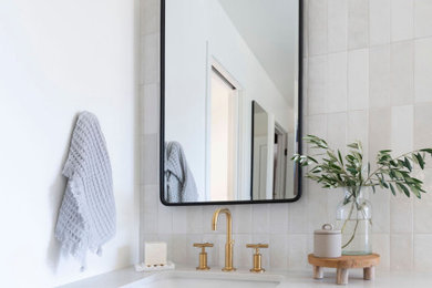 Large trendy master gray tile double-sink freestanding bathtub photo in San Francisco with light wood cabinets, quartzite countertops, white countertops and a built-in vanity
