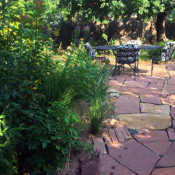 Rustic and Playful Stone Patio In Tranquil Garden